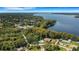 Wide aerial view of waterfront community and lake at 3430 Stonehaven E Ct # A, Palm Harbor, FL 34684