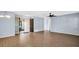 Bright entryway showcasing hardwood floors, open layout, and modern lighting fixtures at 3499 Cedar Ln, Palm Harbor, FL 34684