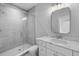 Bathroom with a walk-in shower and marble vanity at 3612 W Renellie Cir, Tampa, FL 33629