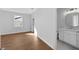 Bedroom with hardwood floors and en-suite bathroom at 3612 W Renellie Cir, Tampa, FL 33629