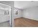 Light-filled bedroom with hardwood floors and adjacent bathroom at 3612 W Renellie Cir, Tampa, FL 33629