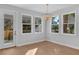 Bright dining area with hardwood floors and access to backyard at 3612 W Renellie Cir, Tampa, FL 33629