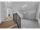 Attached garage with epoxy flooring and stairs at 3612 W Renellie Cir, Tampa, FL 33629