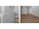 Bright hallway with hardwood floors leading to bedrooms at 3612 W Renellie Cir, Tampa, FL 33629