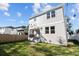 Rear view of house showing gray siding and backyard at 3612 W Renellie Cir, Tampa, FL 33629