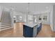 Modern kitchen with island, stainless steel appliances, and hardwood floors at 3612 W Renellie Cir, Tampa, FL 33629