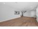 Open living room with hardwood floors and a view of the kitchen at 3612 W Renellie Cir, Tampa, FL 33629