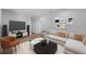 Home theater with large screen TV, comfortable sectional sofa, and movie-themed decor at 3612 W Renellie Cir, Tampa, FL 33629