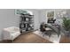 Modern home office with sleek black desk, shelving, and a comfortable chair at 3612 W Renellie Cir, Tampa, FL 33629