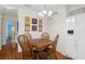 Cozy dining area with wood table and chairs, near kitchen and entry at 37820 Alissa Dr, Zephyrhills, FL 33542