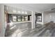 Spacious living area with wood-look floors and backyard view at 4175 103Rd N Ave, Clearwater, FL 33762