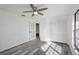 Bright bedroom featuring wood-look floors and a large closet at 4175 103Rd N Ave, Clearwater, FL 33762