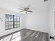 Spacious bedroom with large window and wood-look flooring at 4175 103Rd N Ave, Clearwater, FL 33762
