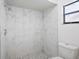 Updated bathroom with marble shower and pebble floor at 4175 103Rd N Ave, Clearwater, FL 33762