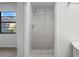 Clean and modern shower with marble tile at 4175 103Rd N Ave, Clearwater, FL 33762