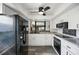Modern kitchen with white cabinets and new appliances at 4175 103Rd N Ave, Clearwater, FL 33762