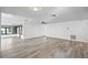 Large living room showcasing vinyl flooring and a ceiling fan at 4175 103Rd N Ave, Clearwater, FL 33762