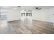 Bright and airy living room with wood-look flooring at 4175 103Rd N Ave, Clearwater, FL 33762