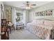 Cozy bedroom with daybed, window seating, and built-in shelving at 4410 Serenity Trl, Palm Harbor, FL 34685