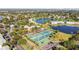 Aerial view showing community amenities including tennis and basketball courts at 5026 Coquina Key Se Dr # 5026, St Petersburg, FL 33705