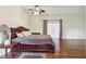 Main bedroom featuring hardwood floors and a ceiling fan at 6411 Barton Rd, Plant City, FL 33565