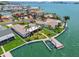 A high angle aerial shot of a waterfront home featuring a private dock and lift at 11683 Grove St, Seminole, FL 33772