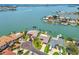 An aerial view showing waterfront homes, private docks, and boat lifts at 11683 Grove St, Seminole, FL 33772