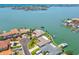 Stunning aerial shot of a waterfront home with a private dock and boat lift at 11683 Grove St, Seminole, FL 33772