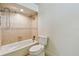 Cozy bathroom showcasing a shower over tub and tiled walls at 11683 Grove St, Seminole, FL 33772