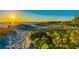 Sandy path through dunes leads to a stunning beach with a beautiful sunset at 11683 Grove St, Seminole, FL 33772
