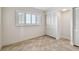 Bedroom featuring tile floor, window with shutters, and white closet doors at 11683 Grove St, Seminole, FL 33772