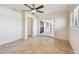 Cozy bedroom with tile flooring, ceiling fan and sliding door at 11683 Grove St, Seminole, FL 33772