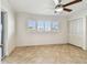 Bright bedroom with plantation shutters and tile flooring at 11683 Grove St, Seminole, FL 33772