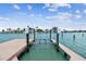Private dock with boat lift providing direct access to the canal and waterfront enjoyment at 11683 Grove St, Seminole, FL 33772