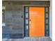 Modern front door with sidelights and digital lock on wood-look tiled wall at 11683 Grove St, Seminole, FL 33772
