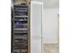 Hallway includes a rack of media equipment and a utility closet with louvered door at 11683 Grove St, Seminole, FL 33772