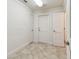 Entry hall features tile flooring, neutral walls and access to three different rooms at 11683 Grove St, Seminole, FL 33772