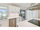 Updated kitchen featuring stainless steel appliances and waterfront views through window at 11683 Grove St, Seminole, FL 33772