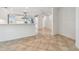 Open concept living room with tile flooring, ideal for entertaining at 11683 Grove St, Seminole, FL 33772