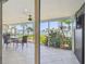 Covered outdoor patio with waterfront views and stylish patio furniture at 11683 Grove St, Seminole, FL 33772
