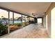 Enjoy the waterfront view from this enclosed patio with tiled floor and ceiling fans at 11683 Grove St, Seminole, FL 33772