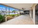 Covered and screened patio overlooking the canal, perfect for outdoor dining and entertaining at 11683 Grove St, Seminole, FL 33772
