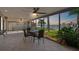 Enclosed patio featuring tiled floor, ceiling fans, and views of the waterfront at 11683 Grove St, Seminole, FL 33772