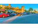 Upscale shopping district with palm trees and parked cars offering a vibrant atmosphere at 11683 Grove St, Seminole, FL 33772