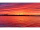 Brilliant sunset over the tranquil waters showcases a peaceful community view at 11683 Grove St, Seminole, FL 33772