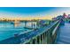 Picturesque waterfront with a boardwalk and boats showcases a vibrant community at 11683 Grove St, Seminole, FL 33772