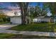 Single-story home with a well-maintained lawn and mature trees at 14115 Eastland Ln, Tampa, FL 33625