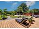 Relaxing wooden deck with lounge chairs and pond view at 1560 53Rd N St, St Petersburg, FL 33710