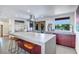 Modern kitchen with concrete countertops, stainless steel appliances, and island seating at 1560 53Rd N St, St Petersburg, FL 33710