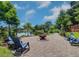 Relaxing patio with fire pit and lake view, perfect for outdoor entertaining at 1560 53Rd N St, St Petersburg, FL 33710